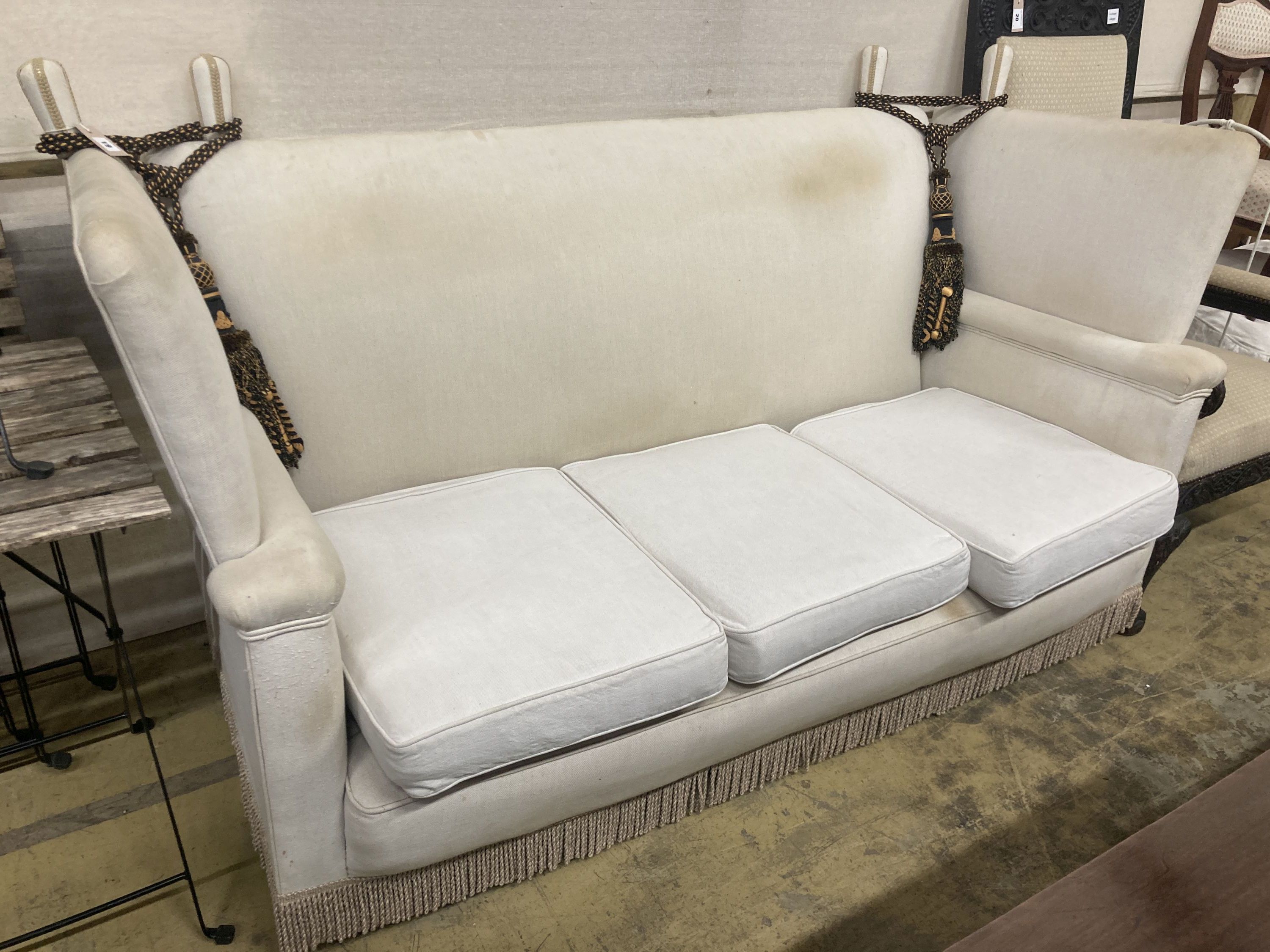 An upholstered Knowle settee, length 184cm, depth 80cm, height 104cm